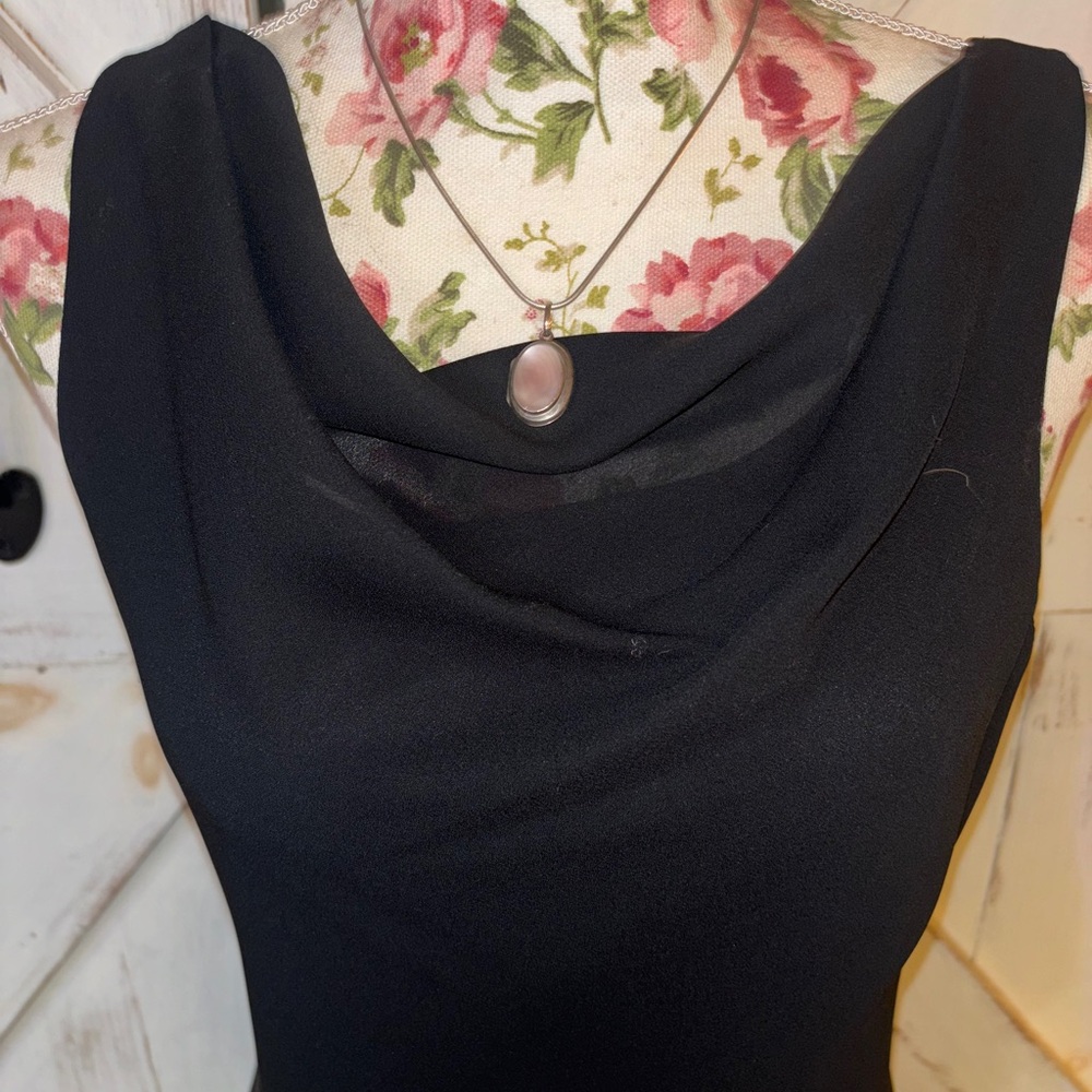 Full length body hugging “little black dress”